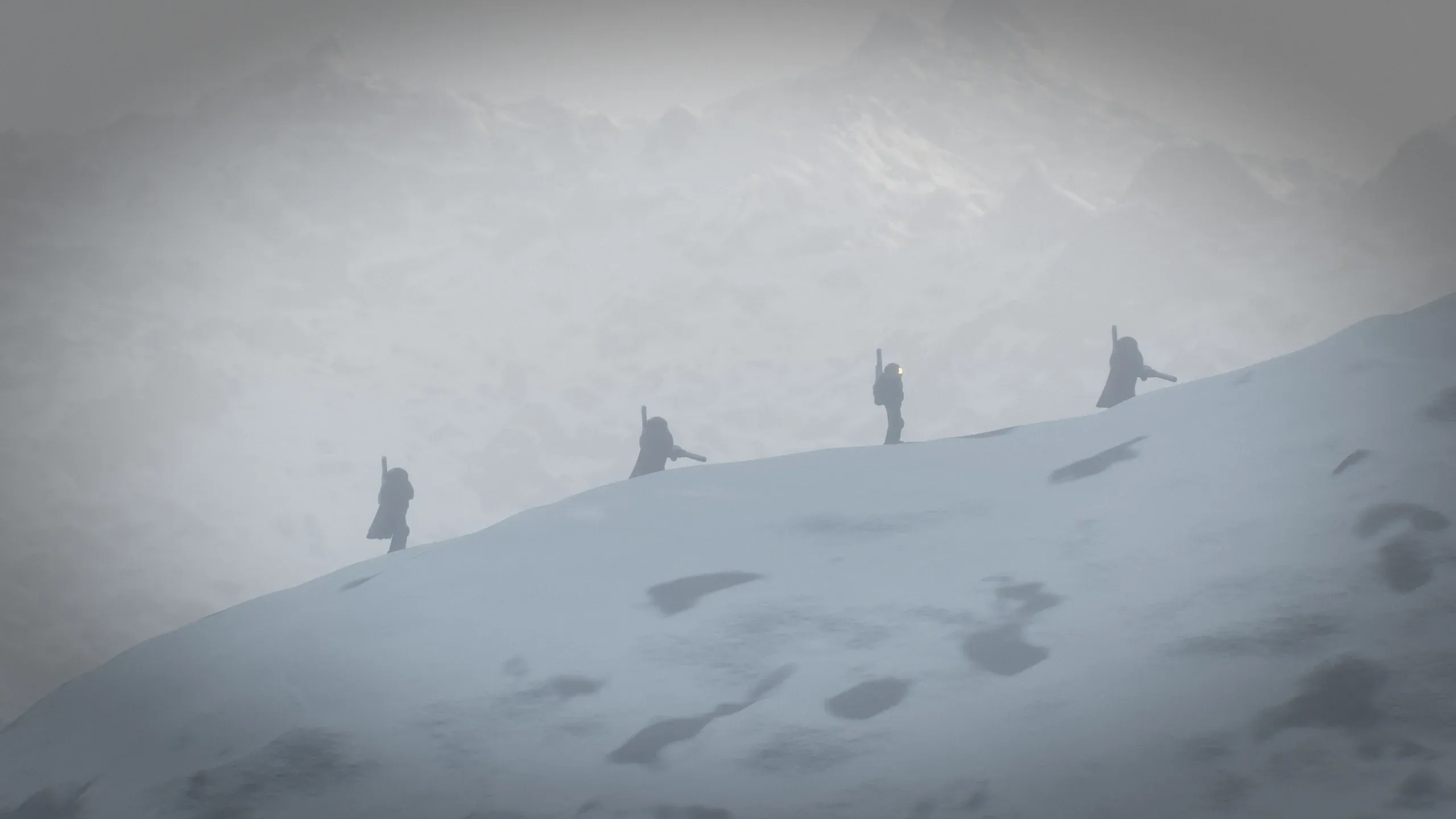 Four Rogues walk single file along a ridge in a blizzard